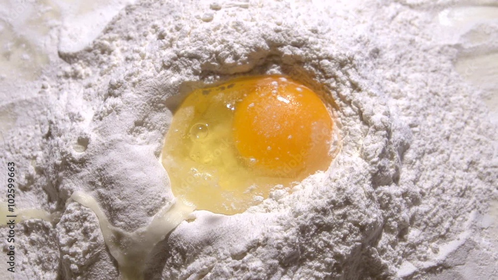 Egg falls into flour. Slow motion 240 fps. Egg falls into flour. Slow motion 240 fps.