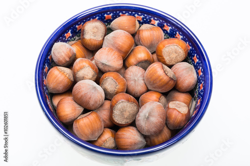 Pile of hazelnuts isolated on white background