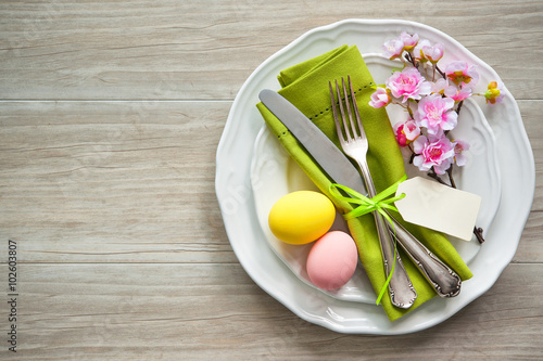 Easter table setting with spring flowers and cutlery