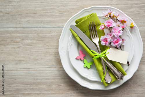 Easter table setting with spring flowers and cutlery