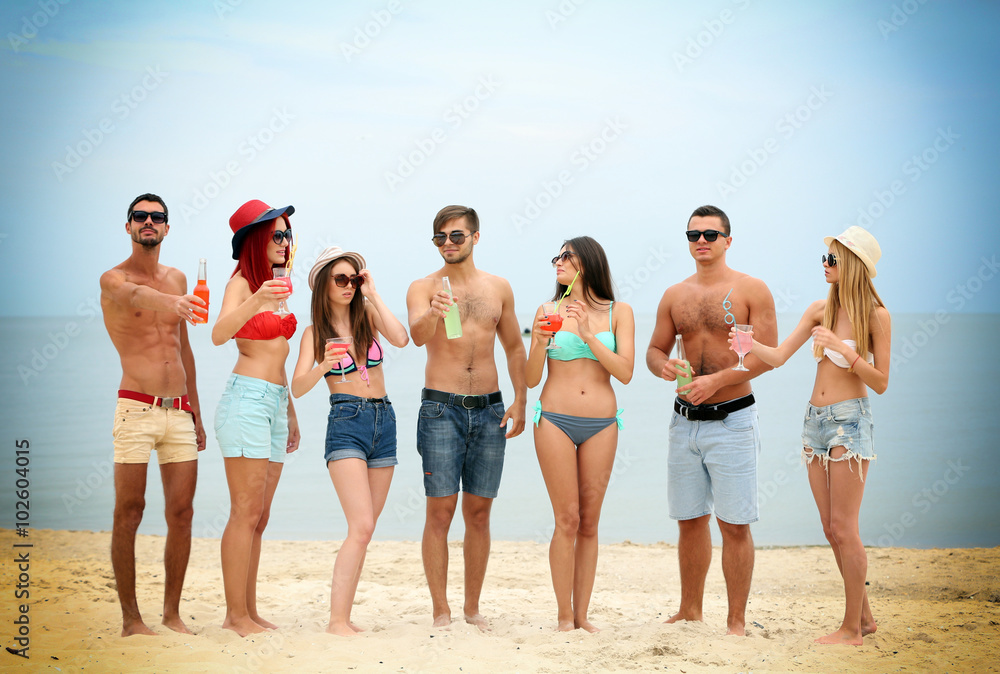 Beautiful young people having fun on beach