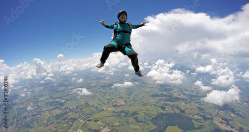 Skydiver woman falling in sitting control