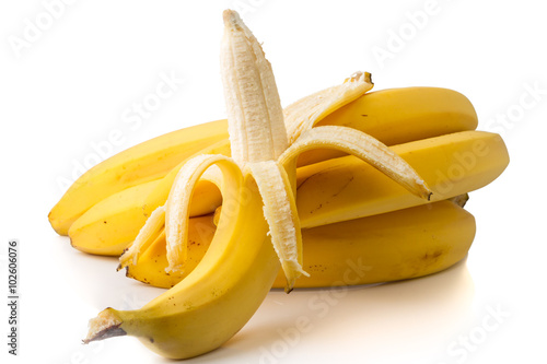 Stem of bananas on white