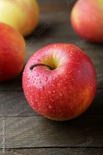 big red apple on old wooden background