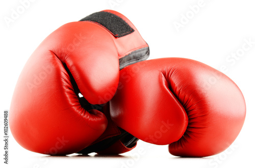 Pair of red leather boxing gloves isolated on white © monticellllo