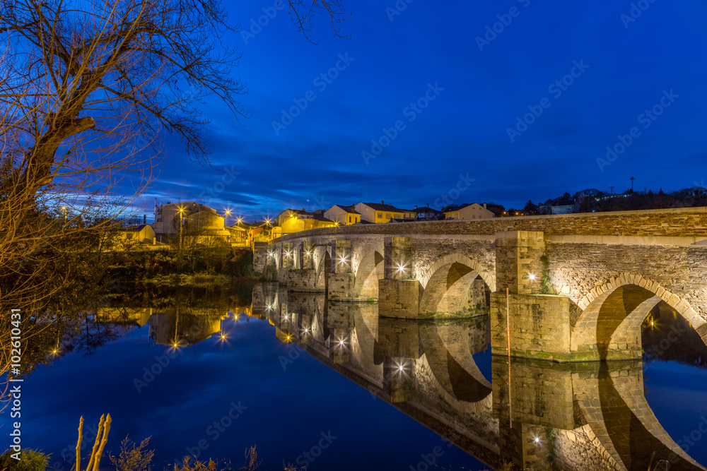 The Roman Bridge in Lugo during blue hour at the Camino Primitivo, a World Heritage