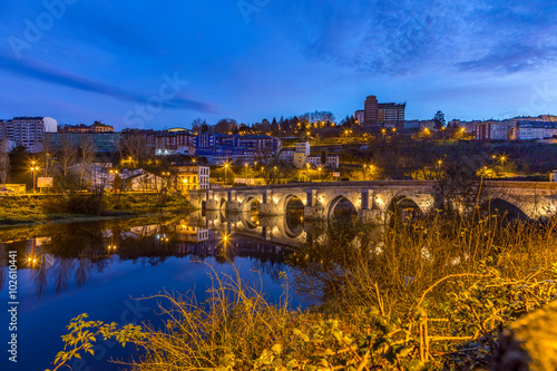 The Roman Bridge in Lugo during blue hour at the Camino Primitivo, a World Heritage