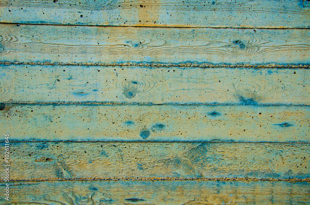 A concrete wall with horizontal traces of the wooden form. A concrete wall with horizontal traces of the wooden form.