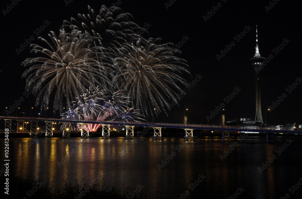 International firework shows light up the sky with dazzling display near Bridge Ponte de Sai Van and Macau tower