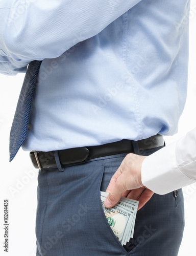 Female hand giving a bribe to businessman