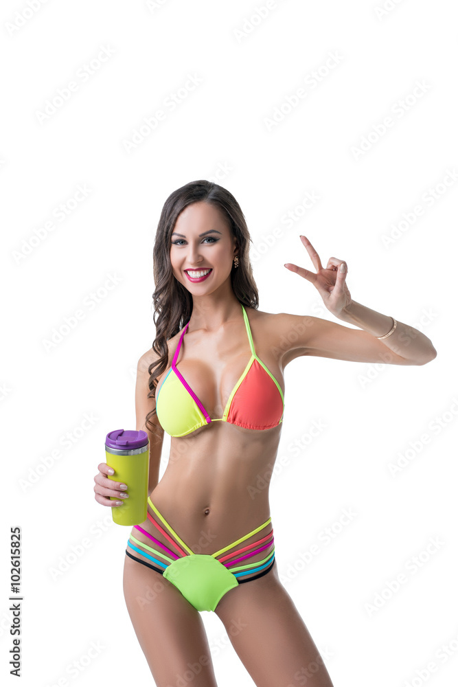Sporty woman in bright bikini posing with shaker Sporty woman in bright bikini posing with shaker