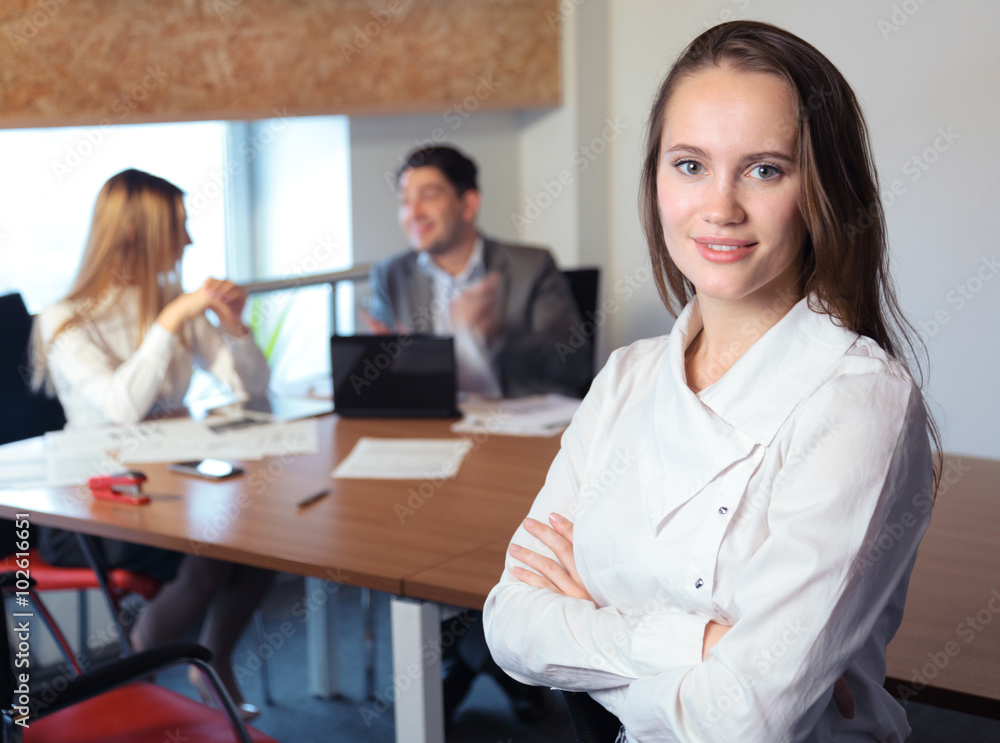 the girl in the office with working colleagues the girl in the office with working colleagues