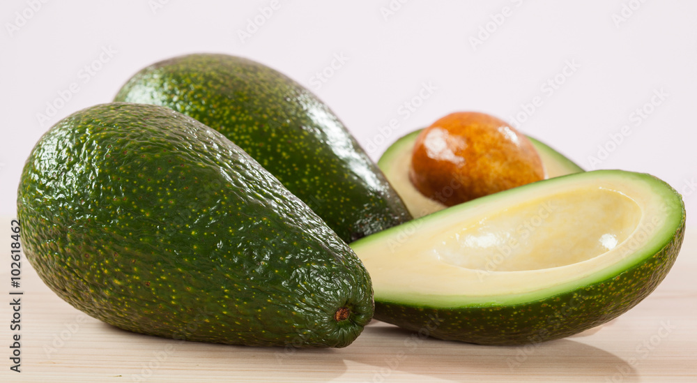 Appetizing avocado on wooden table Appetizing avocado on wooden table