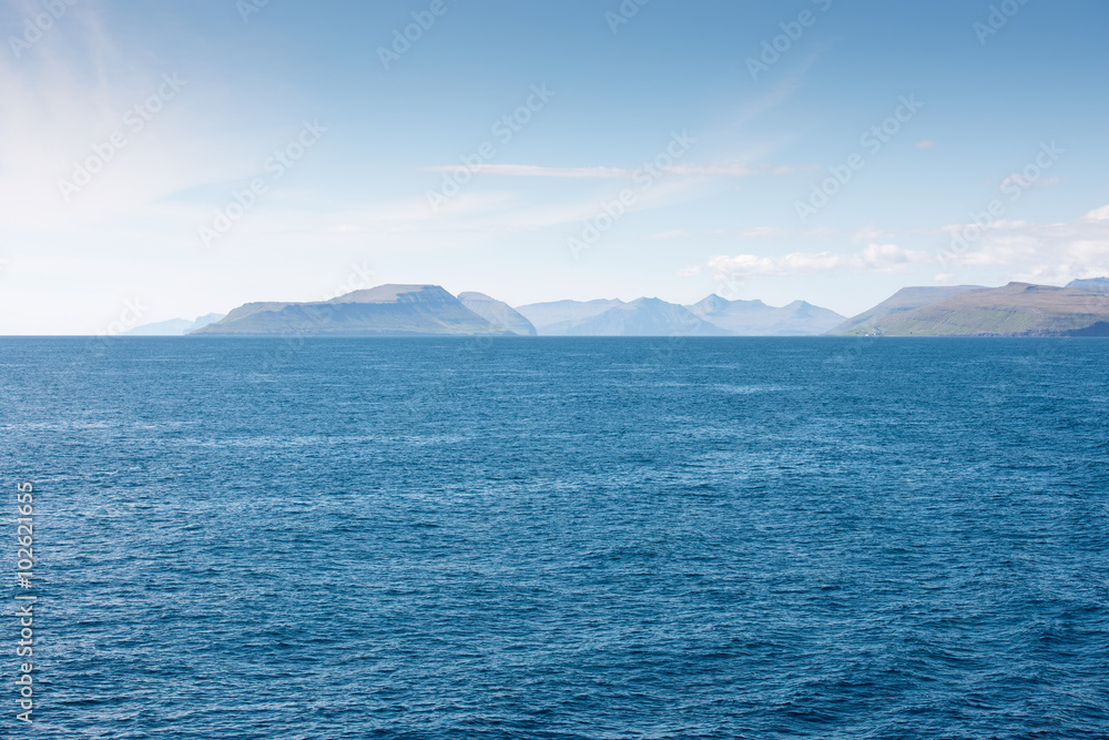 Landscape on the Faroe Islands as seen from a ship