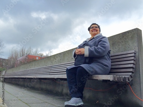 Hispanic Woman Enjoys Lunchbreak Outdoors