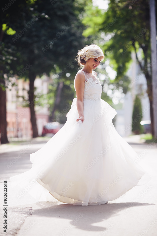 Young beautiful bride posing outdoors Young beautiful bride posing outdoors