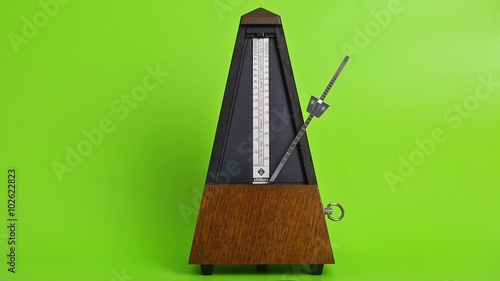 Metronome clicking on green screen photo