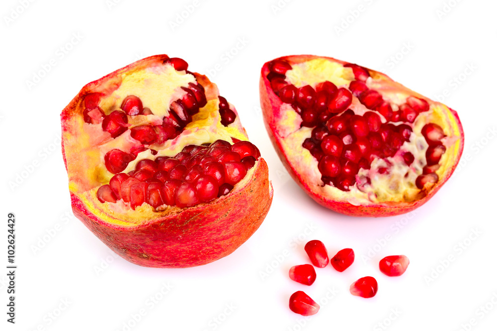 Natural Mature the Broken Red Pomegranate on White Background. Natural Mature the Broken Red Pomegranate on White Background.