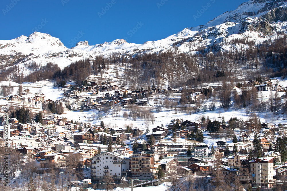 City in italian alpen valley 