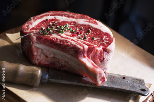 Bone In Rib Eye row Steak and knife