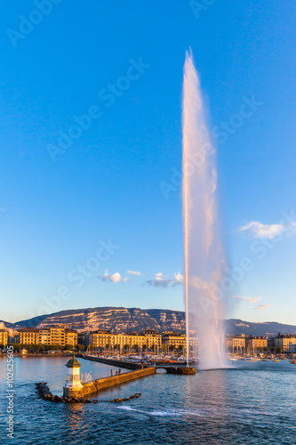 Water jet fountain at sunset in Geneva photo