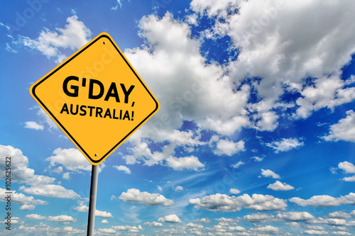 Blue cloudy sky and yellow sign