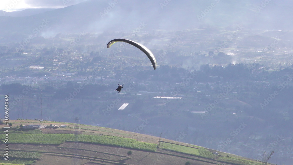 Experience the thrill of tandem or dual paragliding as skilled pilots soar over the breathtaking rural landscapes of South America's high altitude regions. Experience the thrill of tandem or dual paragliding as skilled pilots soar over the breathtaking rural landscapes of South America's high altitude regions.