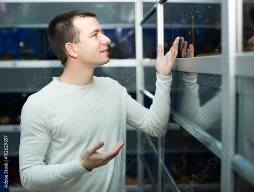 Customer buying tropical fish photo