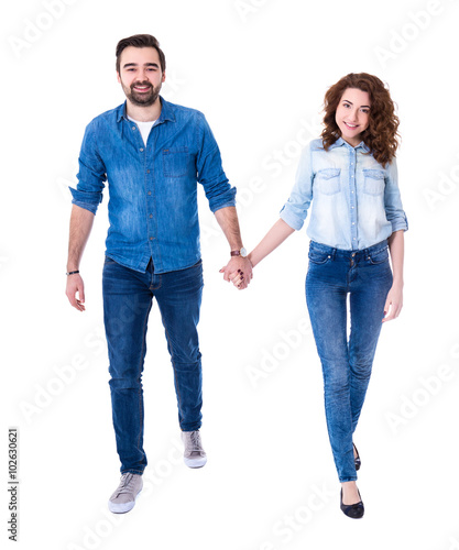 happy couple walking isolated on white