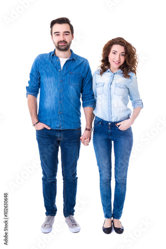 full length portrait of happy couple standing isolated on white
