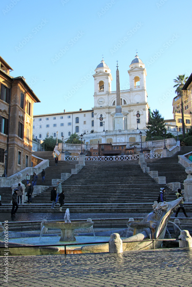 ROME, ITALY - DECEMBER 20, 2012:  The Piazza di Spagna and the Spanish Steps in Rome, Italy. The Spanish Steps are steps between the Piazza di Spagna and the Trinia  dei Monti church at the top.