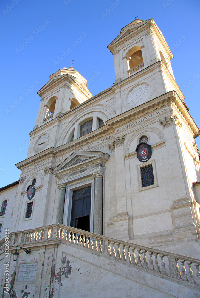 ROME, ITALY - DECEMBER 20, 2012: The church of the Santissima Trinita dei Monti above the Spanish Steps in Rome, Italy