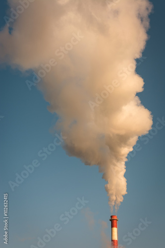 Smoke from the chimney and blue sky