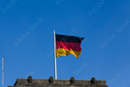 German flag on the top of Reichstag building, Berlin, Germany