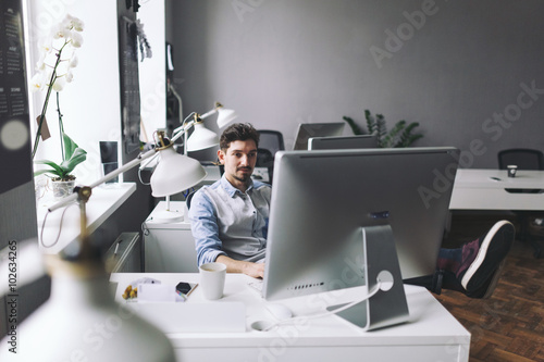 Handsome businessman working in office © arthurhidden