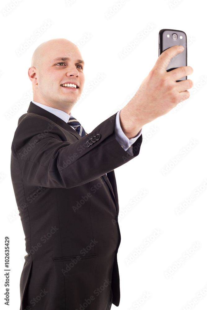 Businessman taking a selfie isolated on white background Businessman taking a selfie isolated on white background