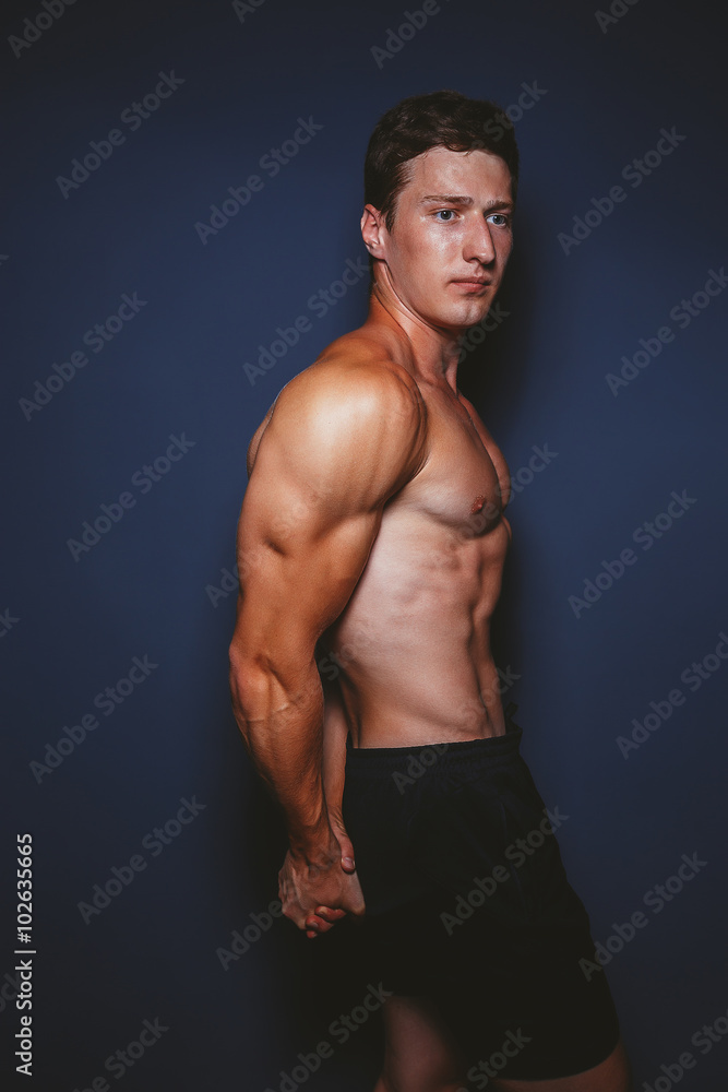 Fototapeta premium Man showing sports figure