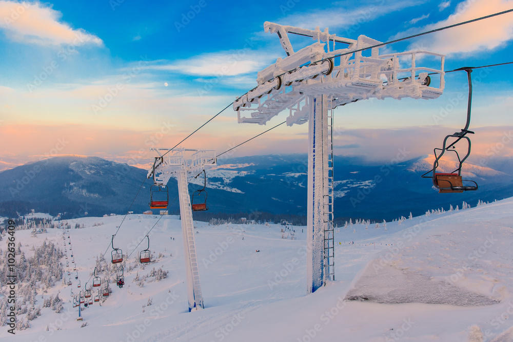Winter mountains panorama with ski lifts Winter mountains panorama with ski lifts