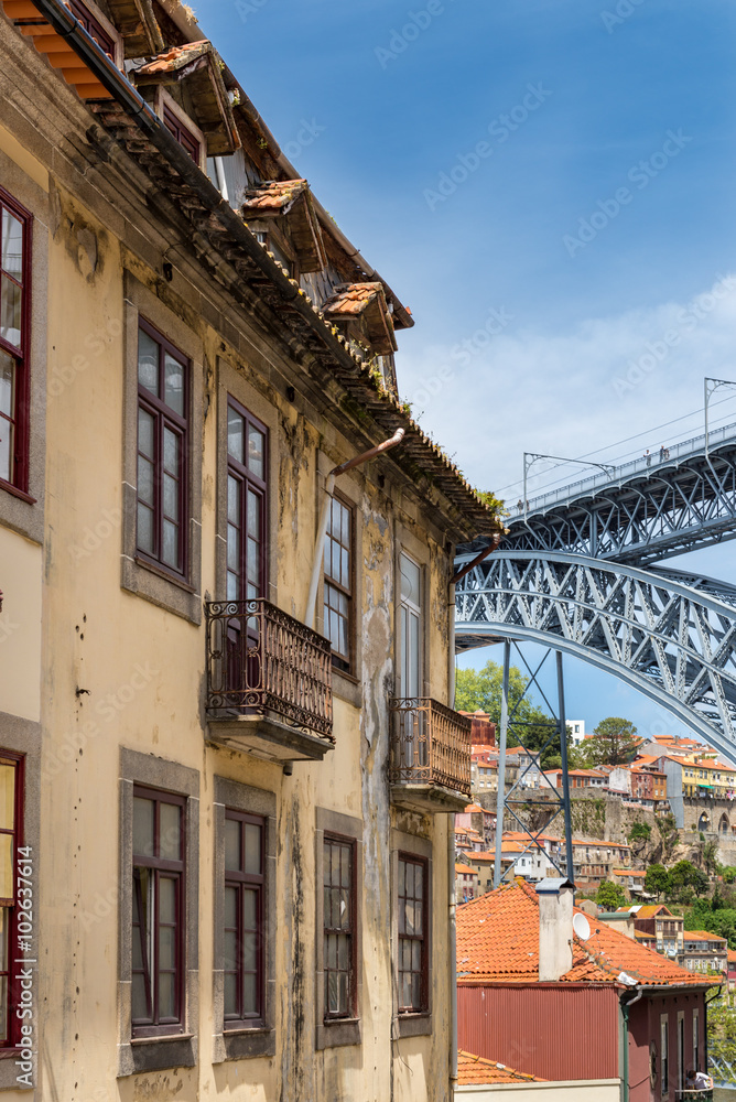 View of facades, alleyway and traditional houses in  Porto