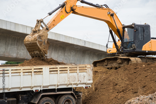 Front end loader dumping stone in a mining quarry