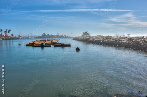 Wallpaper Mural Wide view of foggy marina used as staging area for pipe used to dredge Ventura Harbor.  Torontodigital.ca