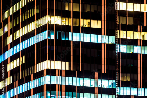 Skyscrapers modern office building with glowing windows at night