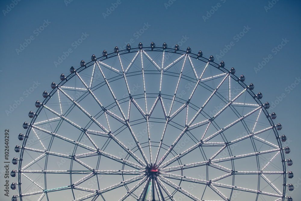 Silhouette of ferris wheel during night time .