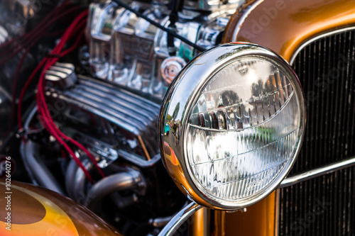 Close up of headlights of a vintage car at a car show