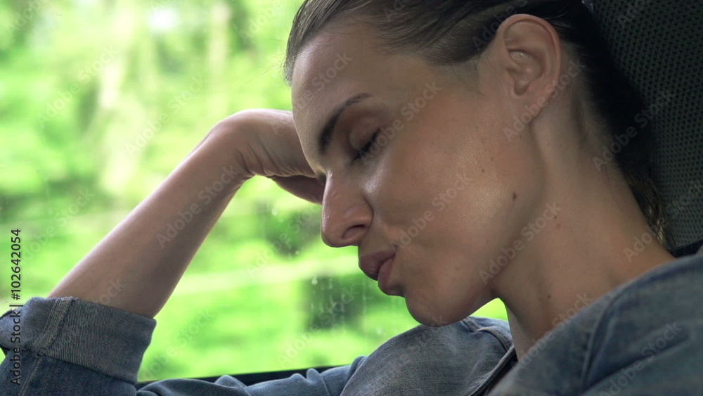 Young woman sleeping on a train, super slow motion shot at 240fps  
