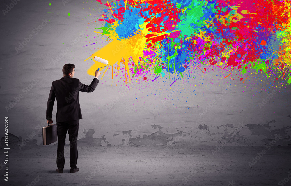 Sales person painting colorful splatter Sales person painting colorful splatter