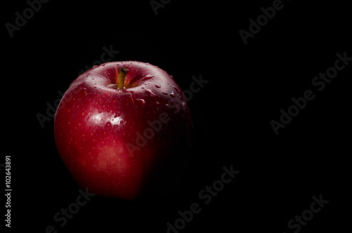 red apple black background