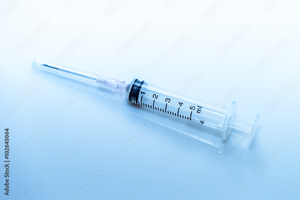 syringes on blue tone syringes on blue tone