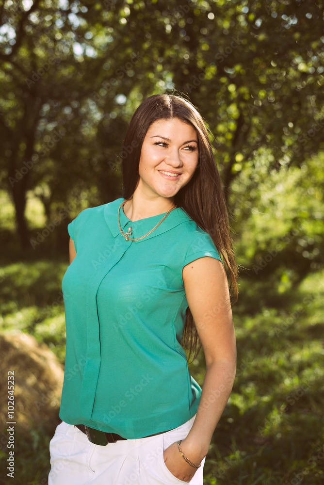 Young beautiful happy business woman in green shirt outdoors Young beautiful happy business woman in green shirt outdoors