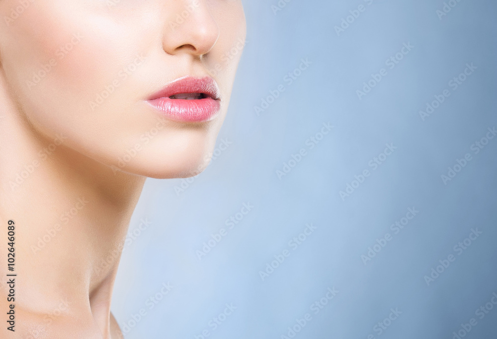Attractive girl with smooth skin over the grey background. Attractive girl with smooth skin over the grey background.